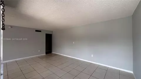 Living - 10303 NW 9th St Cir #102-16, Miami, FL 33172 photo 2 of 4