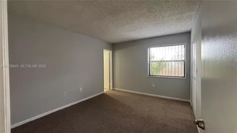 Bedroom - 10303 NW 9th St Cir #102-16, Miami, FL 33172 photo 4 of 6