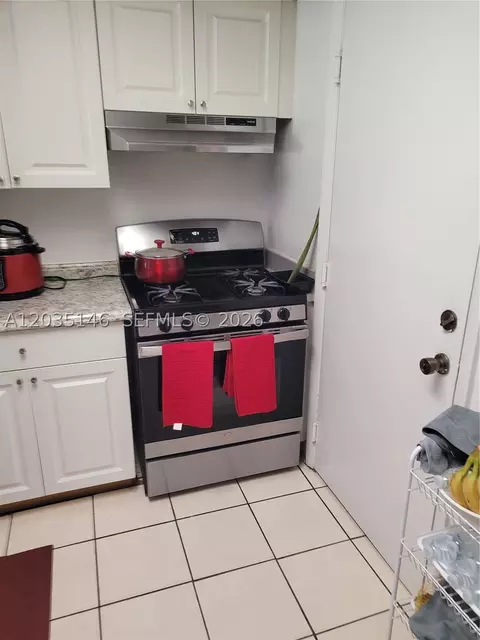 Kitchen - 18101 NW 68th Ave #E105, Hialeah, FL 33015 photo 2 of 3