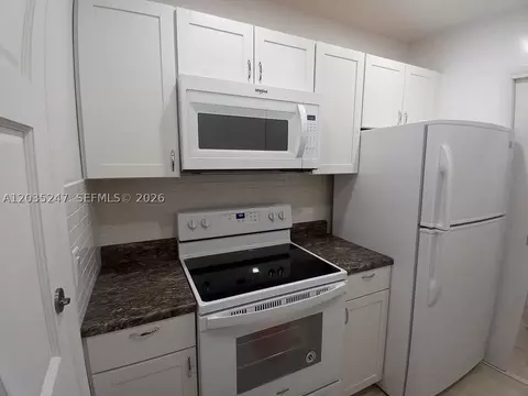 Kitchen - 1250 E Sample Rd #303, Pompano Beach, FL 33064 photo 2 of 2