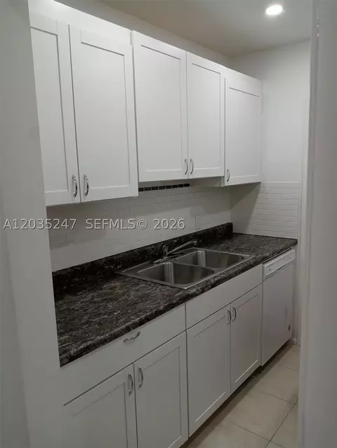Kitchen - 1250 E Sample Rd #303, Pompano Beach, FL 33064 photo 1 of 2