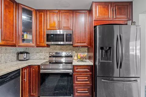 Kitchen - 7701 W 16th Ct, Hialeah, FL 33014 photo 2 of 2
