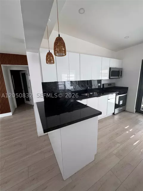 Kitchen - 690 E 46th St, Hialeah, FL 33013 photo 1 of 2