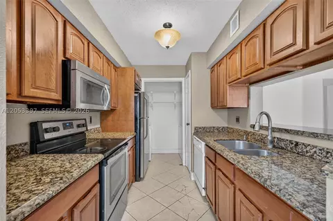 Kitchen - 995 Riverside Dr #120, Coral Springs, FL 33071 photo 1 of 2