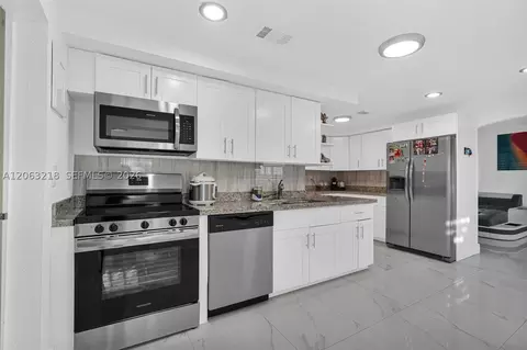 Kitchen - 831 E 10th Pl, Hialeah, FL 33010 photo 3 of 9