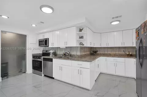 Kitchen - 831 E 10th Pl, Hialeah, FL 33010 photo 4 of 9