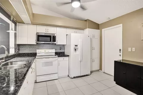 Kitchen - 7566 Red Ruby Dr, Delray Beach, FL 33446 photo 3 of 4