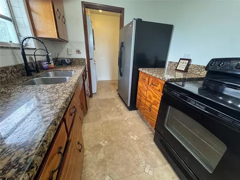 Kitchen - 648 E 40th St, Hialeah, FL 33013 photo 3 of 4