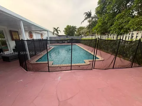 Exterior - 19631 NW 57th Pl, Hialeah, FL 33015 photo 2 of 11