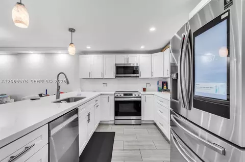 Kitchen - 141 SE 3rd Ave #101, Dania Beach, FL 33004 photo 2 of 4