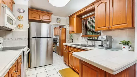 Kitchen - 154 W 59th St, Hialeah, FL 33012 photo 2 of 2