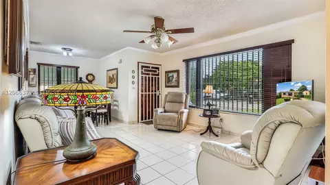 Living - 154 W 59th St, Hialeah, FL 33012 photo 1 of 2