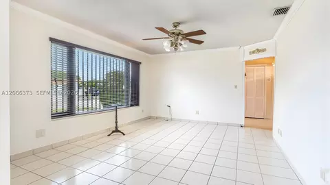 Living - 154 W 59th St, Hialeah, FL 33012 photo 2 of 2