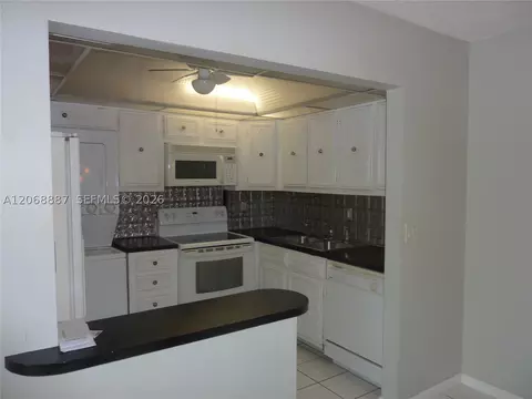 Kitchen - 180 Cypress Club Dr #811, Pompano Beach, FL 33060 photo 1 of 2
