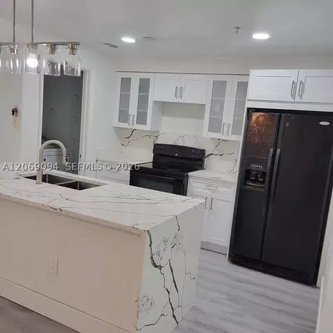 5840 W Sample Rd #302, Coral Springs, FL 33067 photo 2