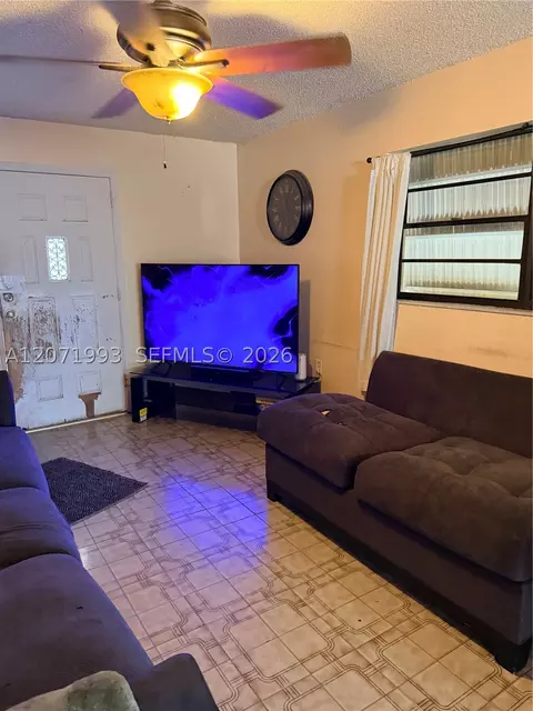 Living - 733 E 26th St, Hialeah, FL 33013 photo 2 of 3