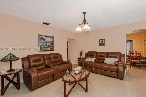 Living - 334 E 11th St, Hialeah, FL 33010 photo 2 of 7