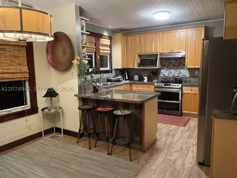 Kitchen - 400 NE 3rd St, Pompano Beach, FL 33060 photo 2 of 3