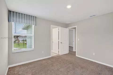 Bedroom - 5610 SEdgewater Cir, Stuart, FL 34997 photo 5 of 7
