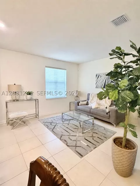 Living - 3344 W 105th Ter, Hialeah, FL 33018 photo 2 of 3