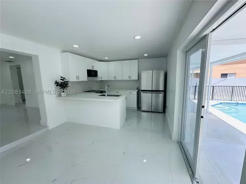 Kitchen - 82 E 16th St, Hialeah, FL 33010 photo 3 of 4