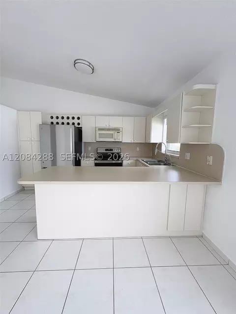 Kitchen - 3397 W 72nd Pl, Hialeah, FL 33018 photo 2 of 3