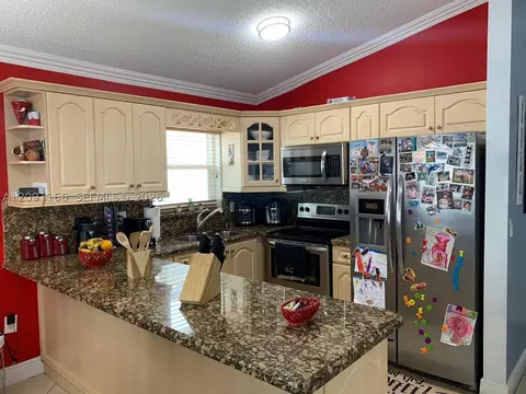 Kitchen - 6940 W 25th Ln, Hialeah, FL 33016 photo 3 of 3