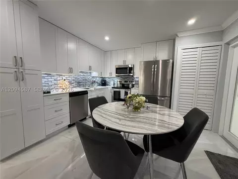 Kitchen - 520 NW 46th St, Pompano Beach, FL 33064 photo 2 of 3
