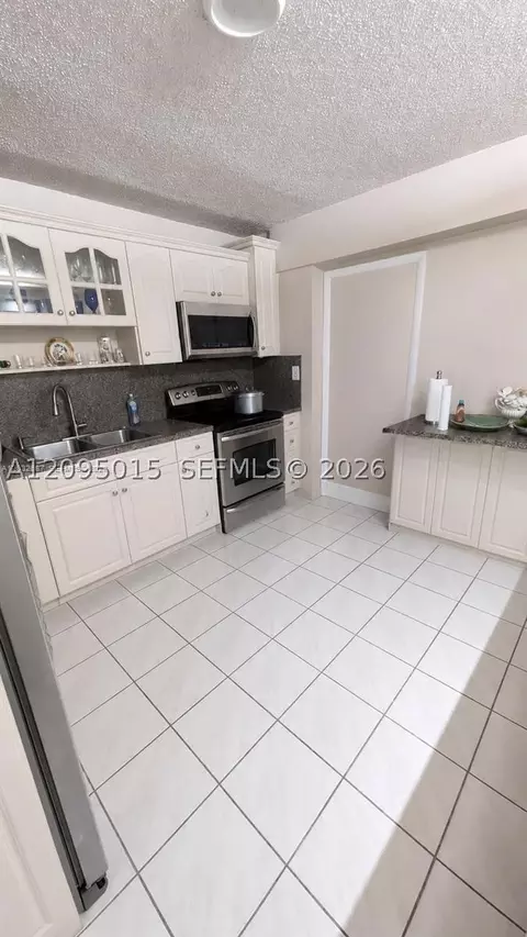 Kitchen - 4596 E 8th Ct, Hialeah, FL 33013 photo 3 of 3