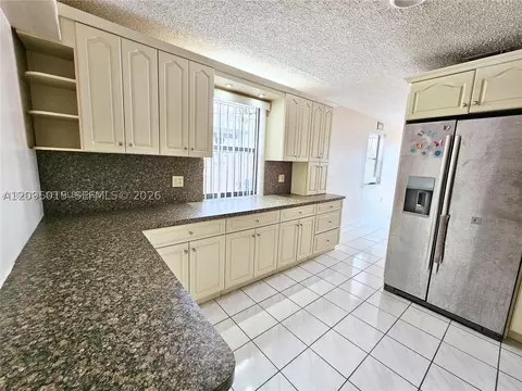 Kitchen - 4596 E 8th Ct, Hialeah, FL 33013 photo 2 of 3