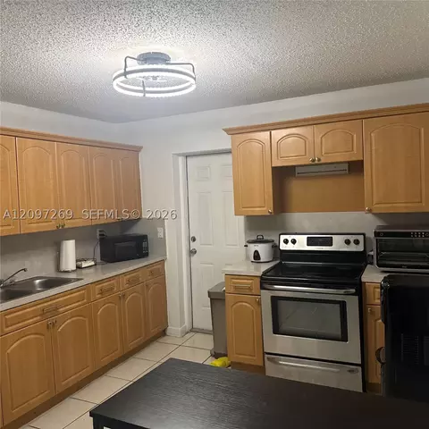 Kitchen - 258 E 46th St, Hialeah, FL 33013 photo 2 of 2