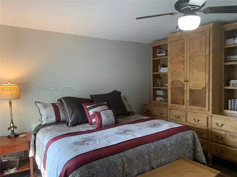 Bedroom - 5463 SE Miles Grant Rd #210, Stuart, FL 34997 photo 8 of 9