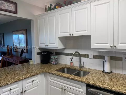 Kitchen - 5463 SE Miles Grant Rd #210, Stuart, FL 34997 photo 3 of 5