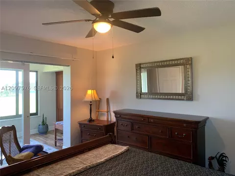 Bedroom - 5463 SE Miles Grant Rd #210, Stuart, FL 34997 photo 3 of 9