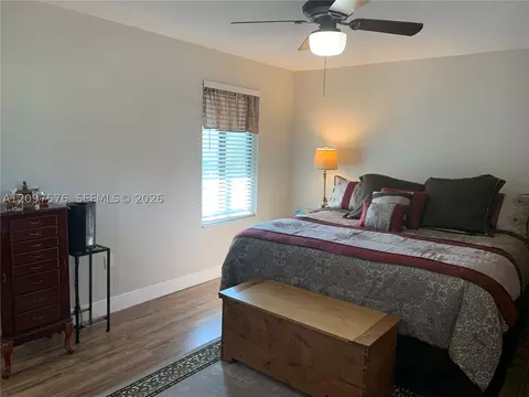 Bedroom - 5463 SE Miles Grant Rd #210, Stuart, FL 34997 photo 5 of 9