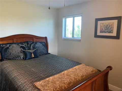 Bedroom - 5463 SE Miles Grant Rd #210, Stuart, FL 34997 photo 1 of 9
