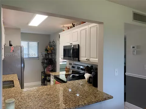 Kitchen - 5463 SE Miles Grant Rd #210, Stuart, FL 34997 photo 5 of 5