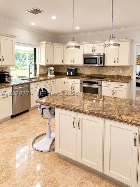 Kitchen - 19265 E Saint Andrews Dr, Hialeah, FL 33015 photo 1 of 4
