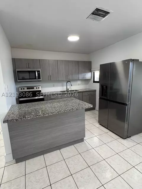 Kitchen - 850 SE 2nd Pl, Hialeah, FL 33010 photo 2 of 3