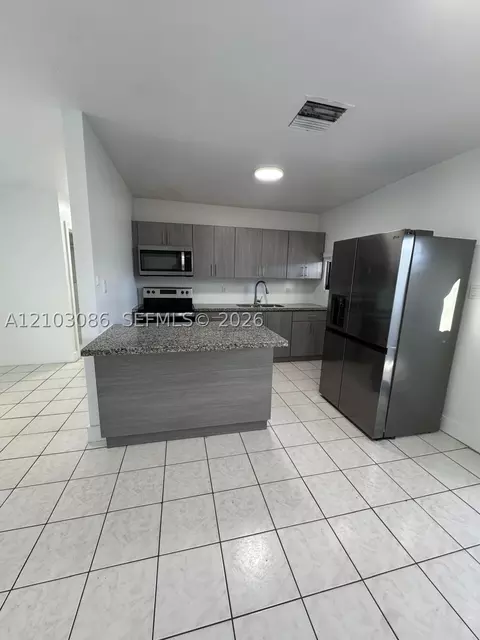 Kitchen - 850 SE 2nd Pl, Hialeah, FL 33010 photo 1 of 3