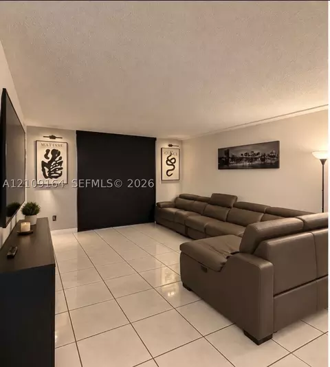 Living - 3285 Foxcroft Rd #E206, Miramar, FL 33025 photo 2 of 2
