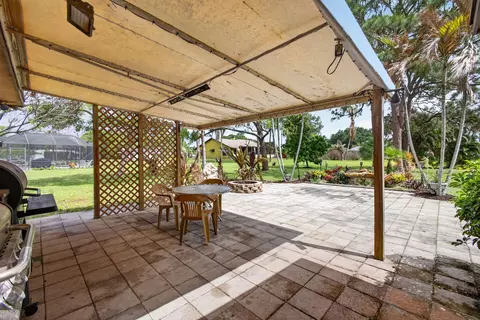 Exterior - 5589 SE Paramount Dr, Stuart, FL 34997 photo 6 of 16