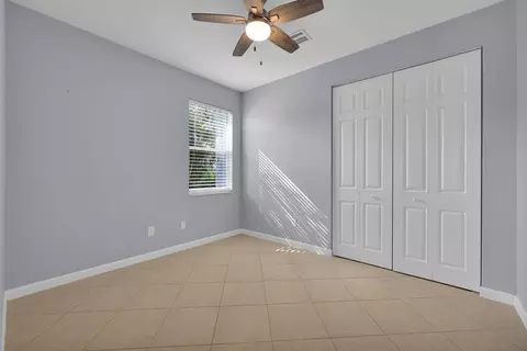 Bedroom - 7041 SE Bay Hill Dr, Stuart, FL 34997 photo 8 of 10