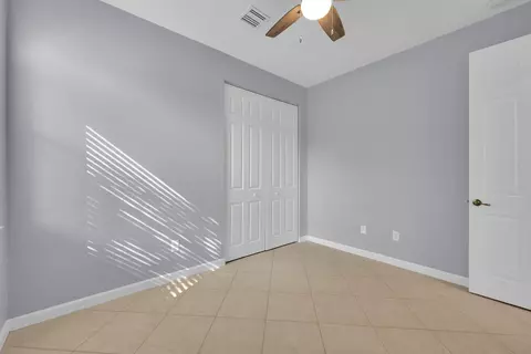 Bedroom - 7041 SE Bay Hill Dr, Stuart, FL 34997 photo 9 of 10