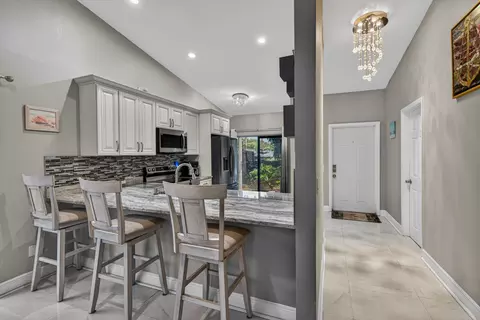 Kitchen - 1036 E Lakes Dr, Pompano Beach, FL 33064 photo 2 of 5