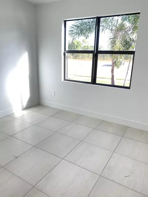 Bedroom - 6950 SE Park Trace Dr, Stuart, FL 34997 photo 2 of 3