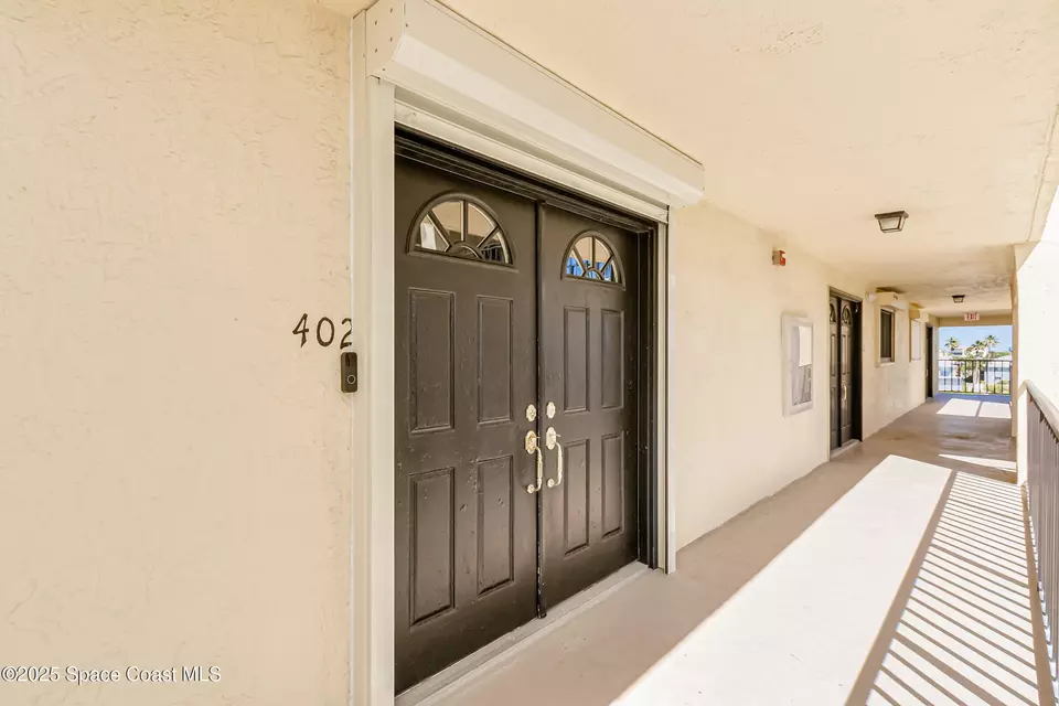 Entry Way - 190 Escambia Ln #402, Cocoa Beach, FL 32931 photo 1 of 3