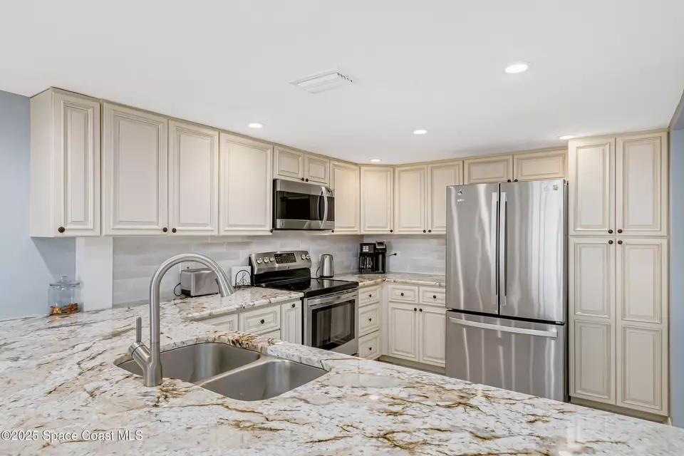 Kitchen - 190 Escambia Ln #402, Cocoa Beach, FL 32931 photo 4 of 4