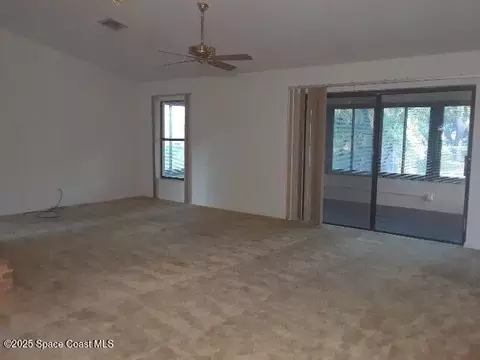 Living - 1173 Scyphers St NE, Palm Bay, FL 32905 photo 1 of 5