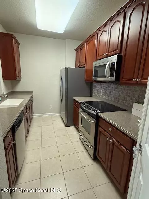 Kitchen - 3868 Lexmark Ln #309, Rockledge, FL 32955 photo 5 of 5
